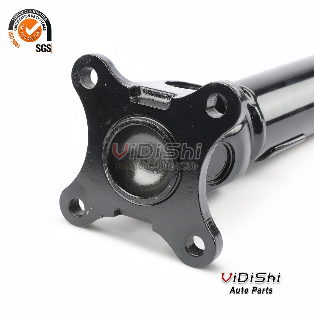 MR580389 Propeller Drive Shaft Replacement for Mitsubishi Pajero 3 Close-up of the square flange plate on the propeller drive shaft with bolt holes and the black ball cage housing behind