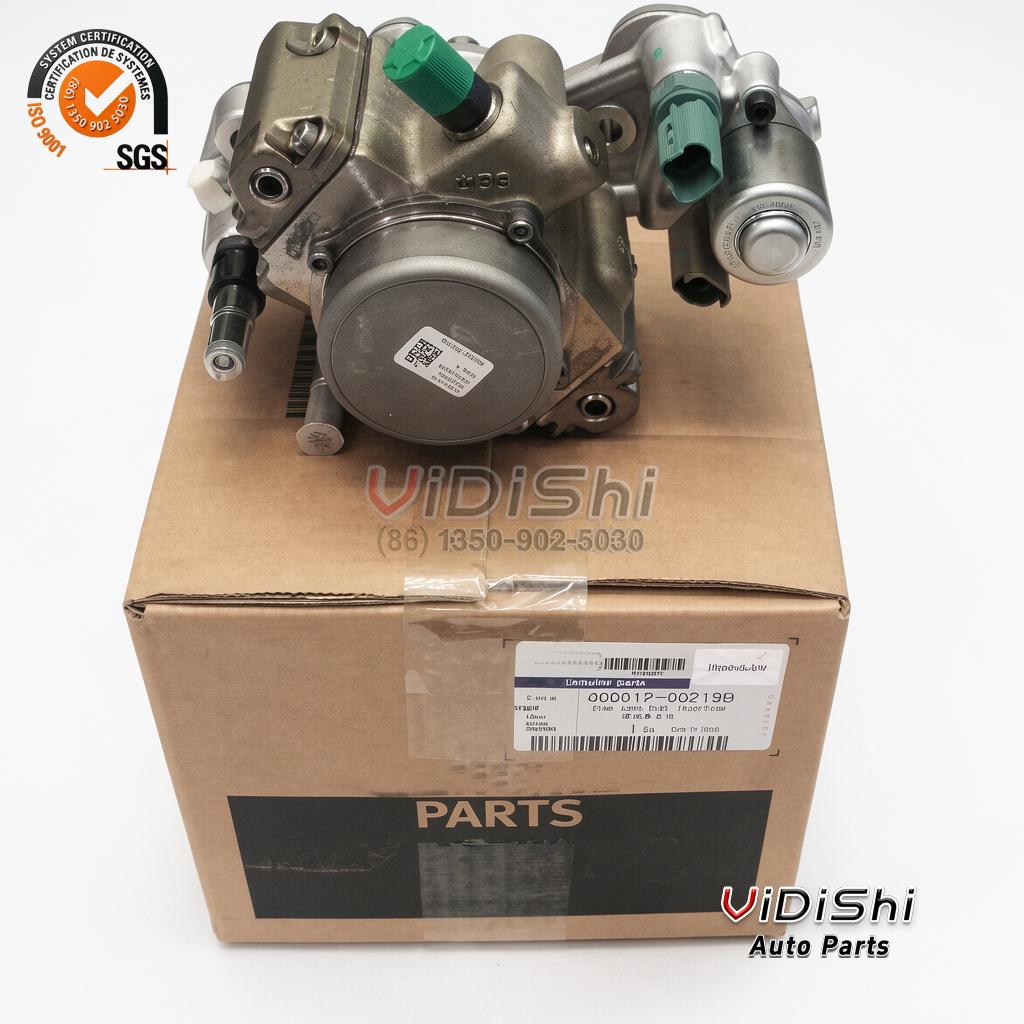49001200219B Common Rail Fuel Pump for Doosan D18 and D24 4 common rail fuel pump on a cardboard carton, green protective caps on the ports, connector on the left flank