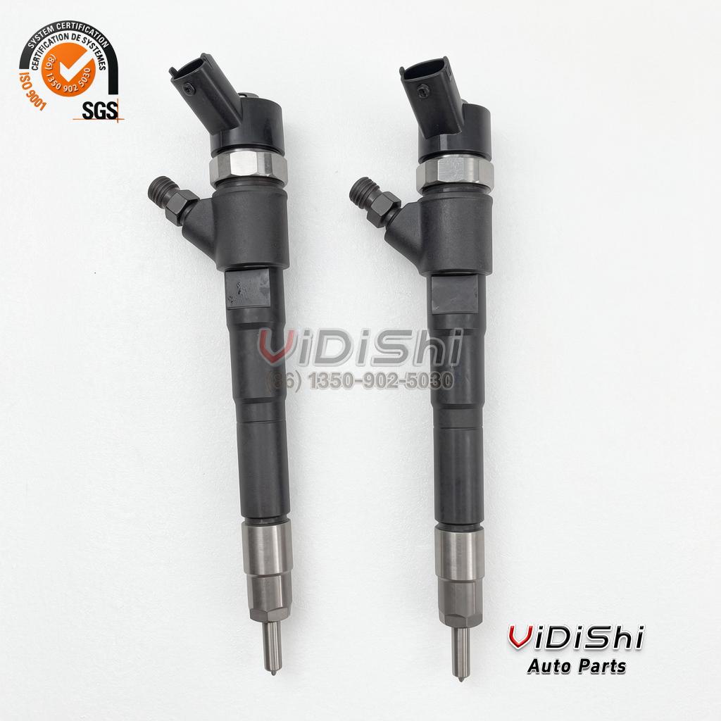 All Products 9 Two 0445110520 injectors standing side by side for a workshop replacement of a pair