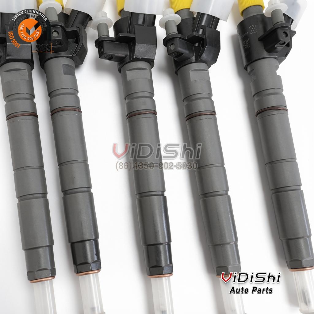 0445117077 Injector for Ford F150 3.0 Power Stroke Diesel 6 Five 0445117077 injectors standing in a row with connectors up and protective caps on the tips