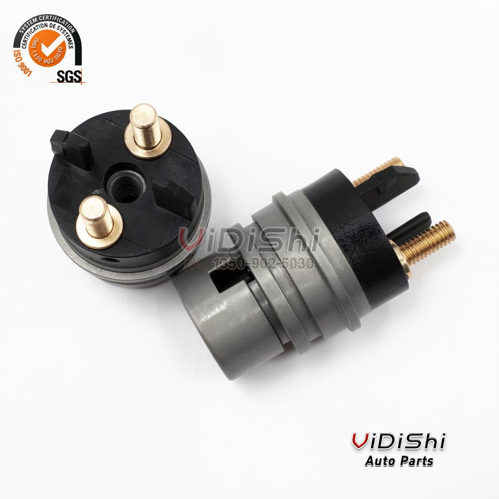 Two F00RJ02702 solenoid valves, one showing the brass terminals and one the valve seat end