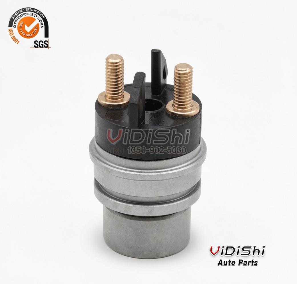 F00RJ02702 injector solenoid valve standing upright with two brass terminal studs above the steel body