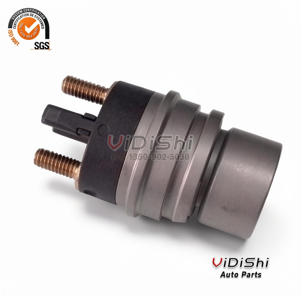 F00RJ02702 Injector Solenoid Valve for Bosch 120 Series 2 F00RJ02702 injector solenoid valve lying on its side with the threaded terminals and ribbed body in view