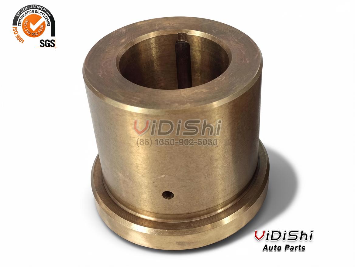Forged bronze-toned chuck bushing with the bore and the cross hole visible