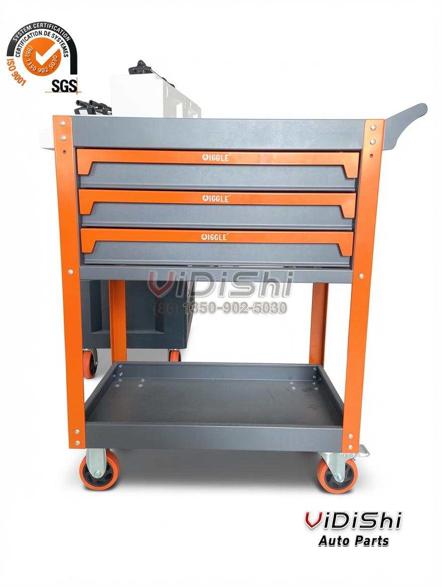 Three-quarter view showing the three drawers, the orange frame and the castors